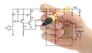 Engineer sketching a circuit schematic